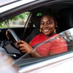 medium-shot-woman-posing-car_23-2150676056